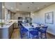 Modern kitchen features stainless steel appliances, a large island, and neutral cabinets at 1200 Sugarloaf Ln, Erie, CO 80516