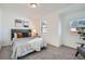 Inviting bedroom with natural light, contemporary decor, and comfortable furnishings at 15282 W 69Th Pl, Arvada, CO 80007