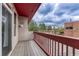 Outdoor balcony featuring wood flooring and neighborhood views at 980 S Locust St # D, Denver, CO 80224