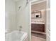 Tile bathroom featuring a tub and shower combination and a modern vanity at 980 S Locust St # D, Denver, CO 80224