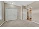 Spacious carpeted bedroom with closet and windows providing natural light at 980 S Locust St # D, Denver, CO 80224