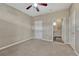 Bedroom featuring carpet, closet space, and an en suite bathroom at 980 S Locust St # D, Denver, CO 80224