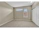 Cozy bedroom with neutral carpet, standard closet and horizontal window at 980 S Locust St # D, Denver, CO 80224
