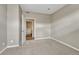 A neutral carpeted bedroom is attached to a bathroom with a single sink at 980 S Locust St # D, Denver, CO 80224