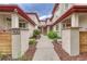 Stylish home featuring a unique courtyard-style entrance and beautifully maintained landscaping at 980 S Locust St # D, Denver, CO 80224