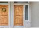 Detailed view of a stylish front door with sidelight and a decorative wreath at 980 S Locust St # D, Denver, CO 80224