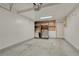 Clean garage space with storage shelves and ample room for parking and projects at 980 S Locust St # D, Denver, CO 80224