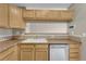 This kitchen has nice light-colored cabinets and stainless steel appliances at 980 S Locust St # D, Denver, CO 80224