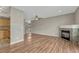 Cozy living room features hardwood floors, a stone fireplace, and an open layout connecting to the kitchen at 980 S Locust St # D, Denver, CO 80224
