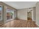 Bright living room with wood floors and sliding door to balcony with railings at 980 S Locust St # D, Denver, CO 80224