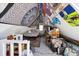 The attic bedroom has a bohemian vibe with tapestries and posters covering the walls at 1365 Clayton St, Denver, CO 80206