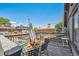 Outdoor deck with seating, offering a relaxing space with city views on a clear day at 1365 Clayton St, Denver, CO 80206