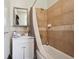 A bathroom is featured, including shower over tub, vanity, mirror, and tile walls at 1365 Clayton St, Denver, CO 80206