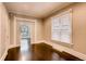Inviting bedroom with hardwood floors, trim detail, and bright windows at 1365 Clayton St, Denver, CO 80206