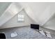 Attic bedroom featuring sloped ceilings, carpet flooring, and a window at 1365 Clayton St, Denver, CO 80206