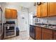The kitchen includes tile flooring, wood cabinets, and stainless steel oven and dishwasher at 1365 Clayton St, Denver, CO 80206