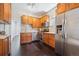 Stylish kitchen featuring stainless steel appliances, ample cabinet space, and dark hardwood floors at 1365 Clayton St, Denver, CO 80206