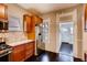 Kitchen featuring stainless steel appliances, granite countertops, and rich wood cabinetry at 1365 Clayton St, Denver, CO 80206