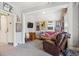 A cozy living room has artwork, ceiling fan, sofa, chair, and other furniture at 1365 Clayton St, Denver, CO 80206