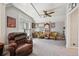 This living room has a cozy feel with a ceiling fan and several pieces of art at 1365 Clayton St, Denver, CO 80206