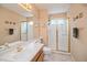 Bright bathroom with a glass shower, tile floor, and neutral paint at 2829 S Fig St, Lakewood, CO 80228