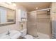 Cozy bathroom featuring shower, neutral colors, and decorative fixtures at 2829 S Fig St, Lakewood, CO 80228