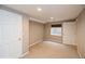 Clean bedroom featuring neutral colors, with natural light and a closet at 2829 S Fig St, Lakewood, CO 80228