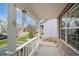 Cozy front porch featuring white railings, offering a pleasant outdoor space to relax and enjoy the neighborhood view at 2829 S Fig St, Lakewood, CO 80228