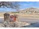 Street view of Summit Glen community entrance with manicured landscaping and picturesque mountain backdrop at 2829 S Fig St, Lakewood, CO 80228