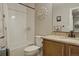 Stylish bathroom featuring a white tub with shower, a toilet, and a vanity with a granite countertop at 16461 E 119Th Way # B, Commerce City, CO 80022