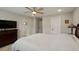Comfortable bedroom featuring neutral walls, a ceiling fan, and a plush bed with a light-colored quilt at 16461 E 119Th Way # B, Commerce City, CO 80022
