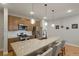 Spacious kitchen featuring a large island, modern appliances, and ample counter space at 16461 E 119Th Way # B, Commerce City, CO 80022