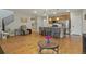 Open-concept layout seamlessly connecting the living room to the kitchen and dining area at 16461 E 119Th Way # B, Commerce City, CO 80022