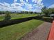 Fully fenced backyard with well-maintained lawn and separate gravel area at 1265 S Biscay St, Aurora, CO 80017
