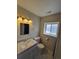 Bright bathroom with a modern vanity, stylish fixtures, and a well-lit mirror at 1265 S Biscay St, Aurora, CO 80017