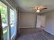 Bright bedroom features neutral tones, a ceiling fan, and natural light from the large windows at 1265 S Biscay St, Aurora, CO 80017
