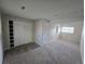 Spacious bedroom features plush carpeting, a large closet, and ample natural light from the window at 1265 S Biscay St, Aurora, CO 80017