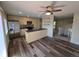 Modern kitchen features stainless steel appliances, custom cabinets, and an island with sink at 1265 S Biscay St, Aurora, CO 80017