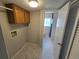 The laundry room offers a washer and dryer hook up and modern floors at 1265 S Biscay St, Aurora, CO 80017