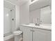 Bright bathroom with a shower and white vanity, offering a clean and modern design at 943 S Zeno Way # 102, Aurora, CO 80017