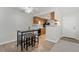 Bright eat-in kitchen featuring wooden cabinets, dining area and modern appliances at 943 S Zeno Way # 102, Aurora, CO 80017