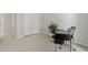 Bright home office area featuring a desk and closet, offering a functional and organized workspace at 943 S Zeno Way # 102, Aurora, CO 80017