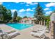Sparkling pool area with ample lounge seating, perfect for relaxation and enjoying sunny days at 943 S Zeno Way # 102, Aurora, CO 80017