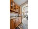 Dining area featuring custom wood cabinets, granite countertops and access to a sunroom at 156 S Lookout Mountain Rd, Golden, CO 80401