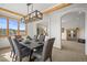 Elegant dining room with a modern chandelier, seating for six, and views of the surrounding landscape at 156 S Lookout Mountain Rd, Golden, CO 80401
