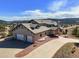 Spacious home with a three car garage and front yard landscaping at 156 S Lookout Mountain Rd, Golden, CO 80401