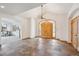 Grand foyer featuring a high ceiling, statement chandelier, and beautiful tile flooring at 156 S Lookout Mountain Rd, Golden, CO 80401