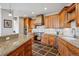 Spacious kitchen featuring custom wood cabinetry, granite countertops, and stainless steel appliances at 156 S Lookout Mountain Rd, Golden, CO 80401