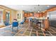 Eat-in kitchen featuring stainless steel appliances, granite countertops, and adjacent access to sunroom at 156 S Lookout Mountain Rd, Golden, CO 80401