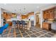 Open kitchen featuring a large island with bar seating, granite countertops, and stainless steel appliances at 156 S Lookout Mountain Rd, Golden, CO 80401